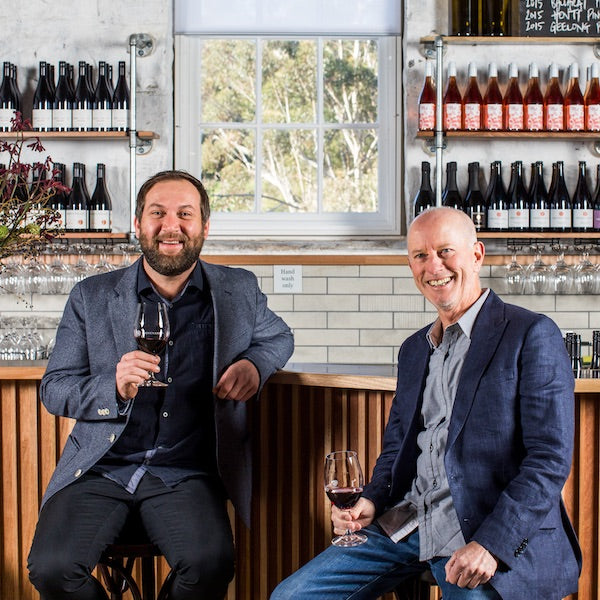 Provenance Winery Geelong owners Sam Vogel and Scott Ireland smiling at the camera and sipping on Red Wine